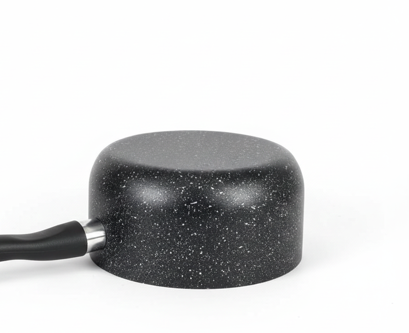 Black speckled sauce pan on a white background