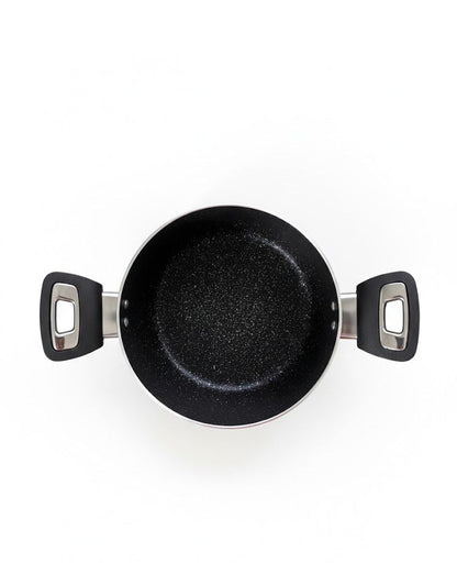 Black frying pan with handles on a white background